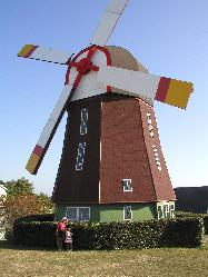 in front of big wind mill